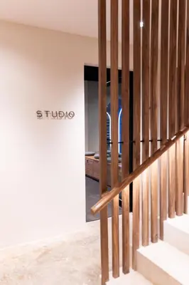 a staircase with wooden railings in a room at Silvestre Nosara Hotel & Residences in Nosara