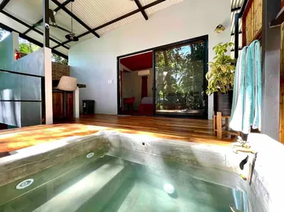 an indoor swimming pool in a house at Industrial Studio with private Jacuzzi in Uvita