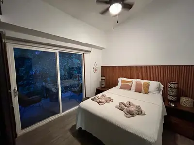 a bedroom with a large bed with towels on it at Playa Hermosa, Mistico, Surf, Bike, Hike, 4 Hab, Lagos, Familia in Jacó