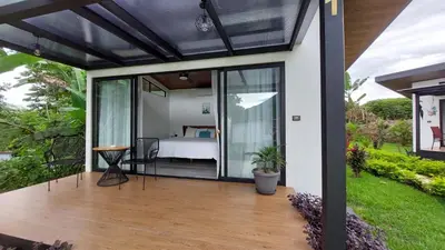 an open patio with a bed and a bedroom at Natura Bungalows in Fortuna