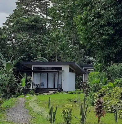 a small house in the middle of a garden at Natura Bungalows in Fortuna