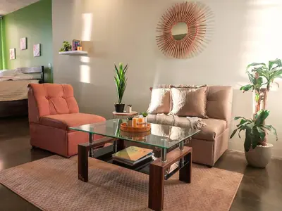 a living room with a couch and a coffee table at 906A URBN Barrio Escalante Estudio con A/C y Parqueo in San José