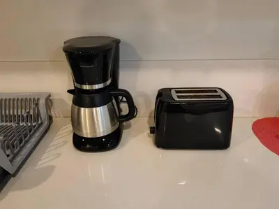 a coffee maker and a toaster sitting on a counter at 906A URBN Barrio Escalante Estudio con A/C y Parqueo in San José
