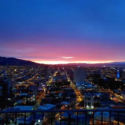a view of a city at night with lights at 906A URBN Barrio Escalante Estudio con A/C y Parqueo in San José