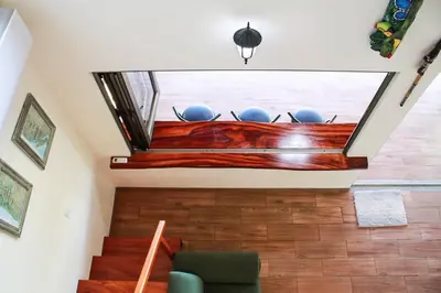 a living room with a skylight in a house at Casita Colibri–Mile to the Beach–Cable&Fiber Wifi! in Uvita
