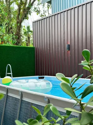 a hot tub on a patio with a fence at Villa El Bosque Dorado in Fortuna
