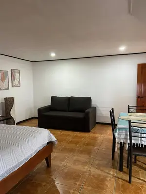 a living room with a couch and a table at SilvaMar in Puntarenas