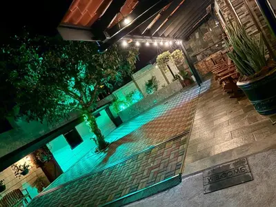 an overhead view of a swimming pool at night at Cabañas Tierra Fértil #2 in Montaña