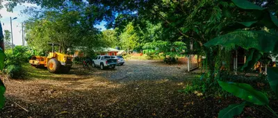 a tractor and a truck parked in a yard at Casa Rancho Verde in Monterrey