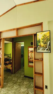 a room with a bunk bed and a room with a mirror at Hospedajes Richie Eco Camp in Providencia