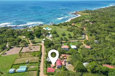 an aerial view of a house with a hot air balloon at Casa Palma Real in Playa Junquillal