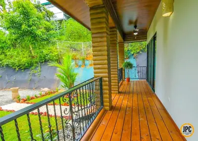 a porch of a house with a painting on the wall at Modern Mountain View Home by Nauyaca Waterfall in Platanillo
