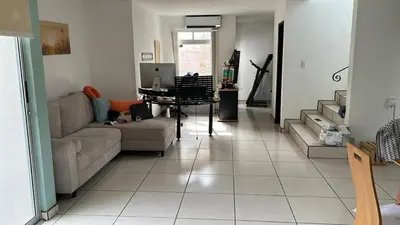 a living room with a couch and a table at casa la luz Orotina in Orotina