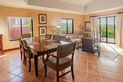 a dining room with a table and chairs at Serene 3BR Condo - Bougainvillea - Reserva Conchal Golf Resort in Playa Conchal