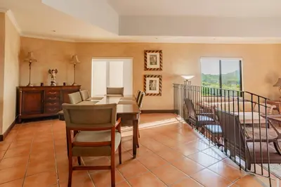 a dining room with a table and chairs at Serene 3BR Condo - Bougainvillea - Reserva Conchal Golf Resort in Playa Conchal