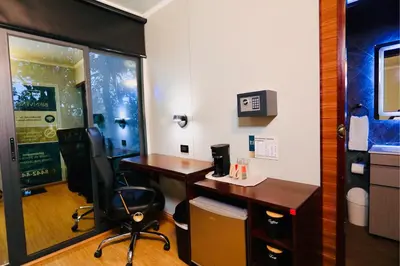 an office with a desk and a chair in a room at Contenedores Boutique Hotel in Platanal