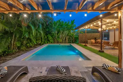 a swimming pool in the middle of a yard at Casa Heliconias La Fortuna Private Pool in Fortuna