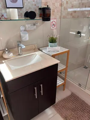 a bathroom with a sink and a shower at Villazul 2 in Poás