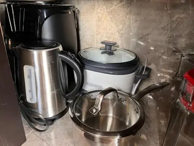 a kitchen counter with a pot and a coffee maker at Villazul 2 in Poás