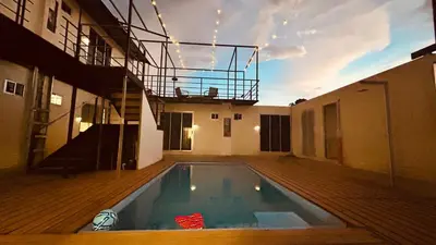 a house with a swimming pool on a deck at Emi’s Place Container Living in Uvita