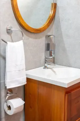 a bathroom with a sink and a mirror at Casa Roble Fortuna in Fortuna