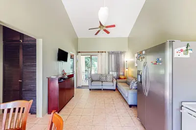 a kitchen with a refrigerator and a living room at Dolce Vita 7028 in Coco