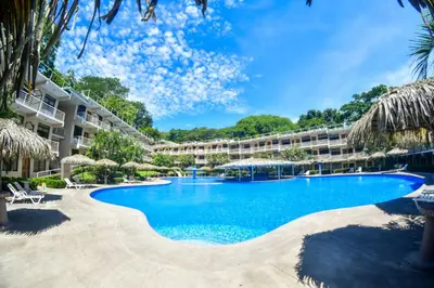 an image of a swimming pool at a resort at Hotel Arenas en Punta Leona in Jacó
