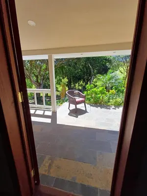 a door leading to a patio with a bench outside at B&B Rosa Dei Venti in Tronadora