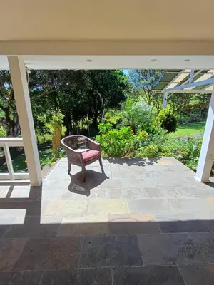 a bench sitting on a patio at B&B Rosa Dei Venti in Tronadora