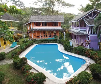 an aerial view of a house with a swimming pool at Villas de la Bahia Playa Tambor in Tambor