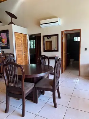 a dining room with a wooden table and chairs at Hidden Paradise Tennis and Pickleball Getaway in Esperanza