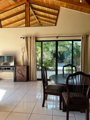 a dining room with a table and chairs and a tv at Hidden Paradise Tennis and Pickleball Getaway in Esperanza