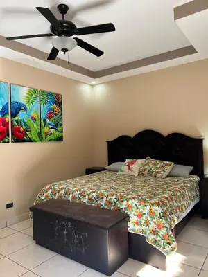 a bedroom with a bed and a ceiling fan at Hidden Paradise Tennis and Pickleball Getaway in Esperanza