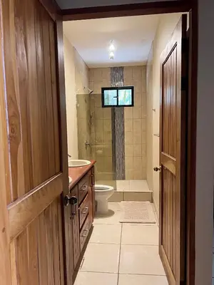 a bathroom with a toilet and a sink and a shower at Hidden Paradise Tennis and Pickleball Getaway in Esperanza
