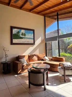 a living room with a couch and a table at Hidden Paradise Tennis and Pickleball Getaway in Esperanza