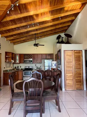 a kitchen with a wooden ceiling and a table and chairs at Hidden Paradise Tennis and Pickleball Getaway in Esperanza