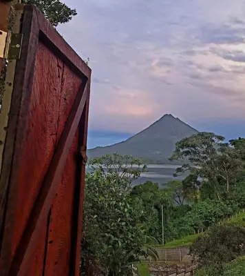 a view of a mountain and a body of water at Rustico Villa Arenal in Fortuna