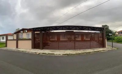 a large wooden garage with a large wooden gate at Apartamentos Maily in Fortuna