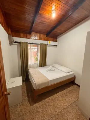 a bedroom with a bed and a wooden ceiling at Apartamentos Maily in Fortuna