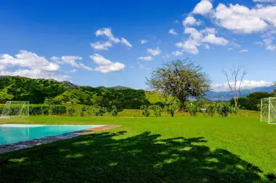 a green field with a soccer ball and a soccer goal at Finca de La Luna in Atenas