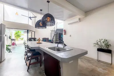 a kitchen with a sink and a counter at Private pool & rooftop patio Hot tub, AC, WI-FI in Jacó