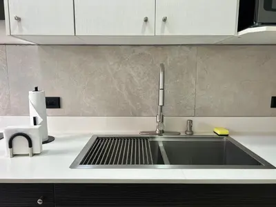 a kitchen sink with a faucet on a counter at Celajes del Poás in Poás