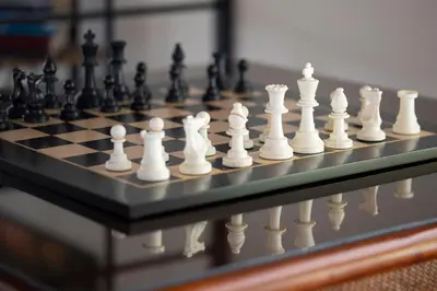 a close up of a chess set on a chessboard at Villa San Ignacio in Alajuela City