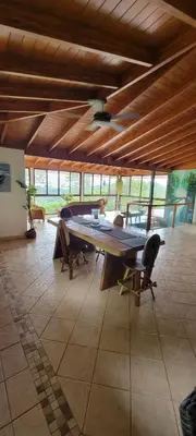 a large dining room with a large table and chairs at Casa Garrobo in Laguna