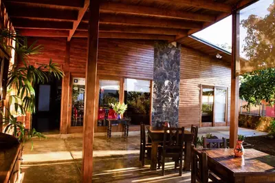 an open patio with a table and chairs at Casa Amanecer Bed & Breakfast in San Ramón