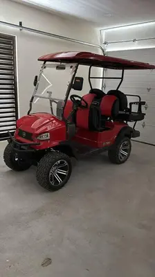 a red golf cart parked in a garage at Casa Mon Coeur-Playa Del Coco Ocean View in Coco