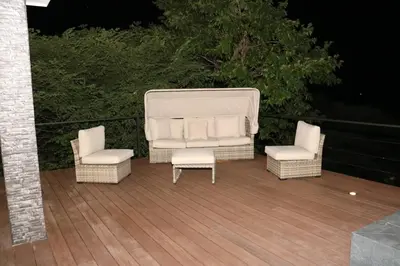 two chairs and a couch and two chairs on a deck at Casa Mon Coeur-Playa Del Coco Ocean View in Coco