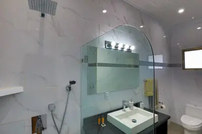a bathroom with a sink and a mirror at Ojochal Magnificent Ocean View in Ojochal