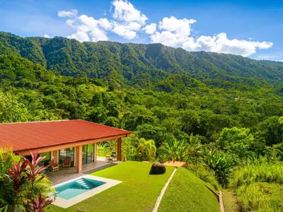 a villa with a swimming pool and a mountain at Villa Roca Ocean to Mountain Views - by Pura Villas in Ojochal