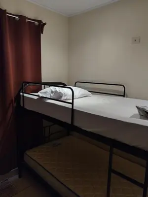 a bunk bed in a room with a mattress at Casa Mangos in Orotina